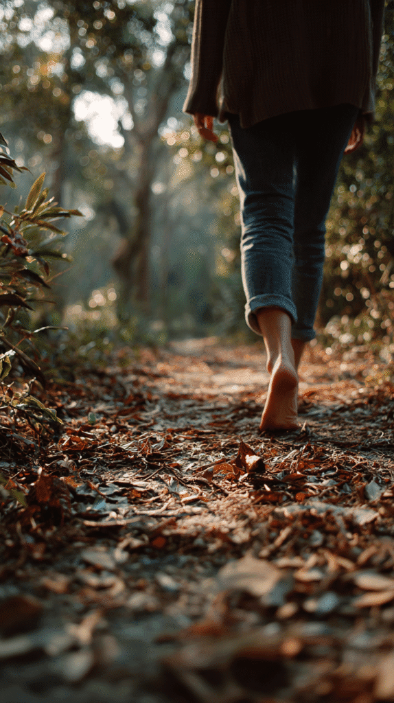 a woman walks barefoot on a nature walk
